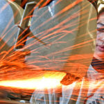 Richardson Ng, 2nd year Mechanical Technician - Tool & Die Maker at Centennial College, watches the sparks fly off a grinder in Precision Machining lab.