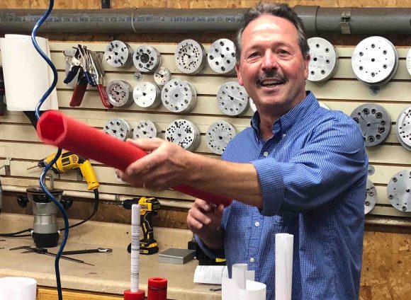 Joel Trusty shows off one of the company's products